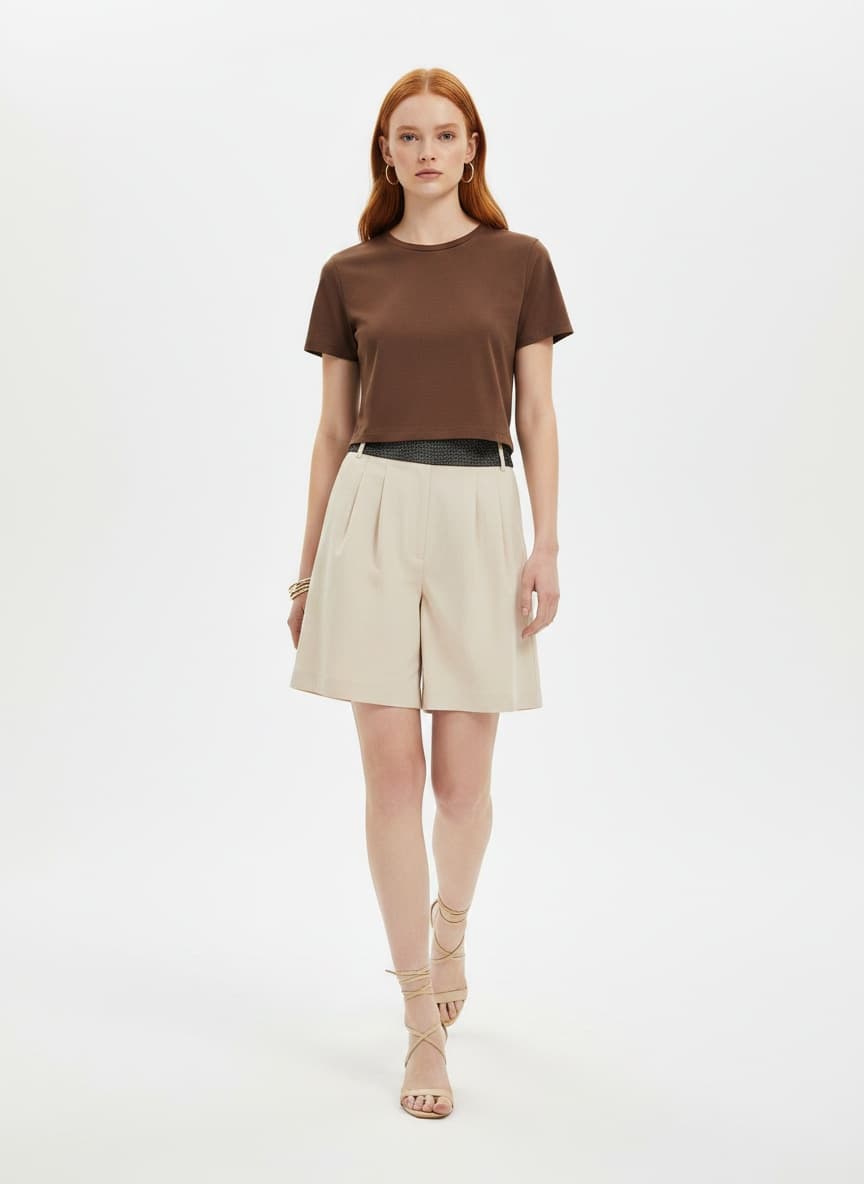 On-model wholesale catalog photo of a brown crew-neck tee and cream shorts for the Woven Beach Tote Bag SKU in an Alovia line sheet